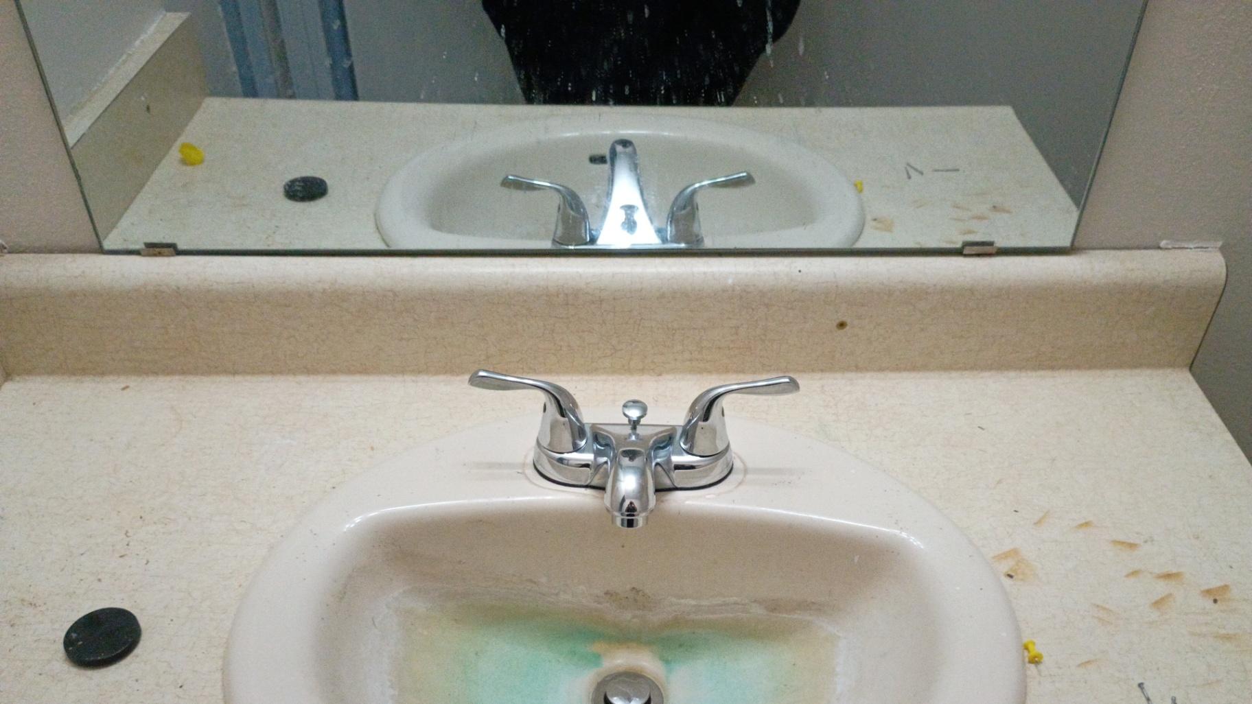 Bathroom sink before cleaning by Nelly Cleaning Service