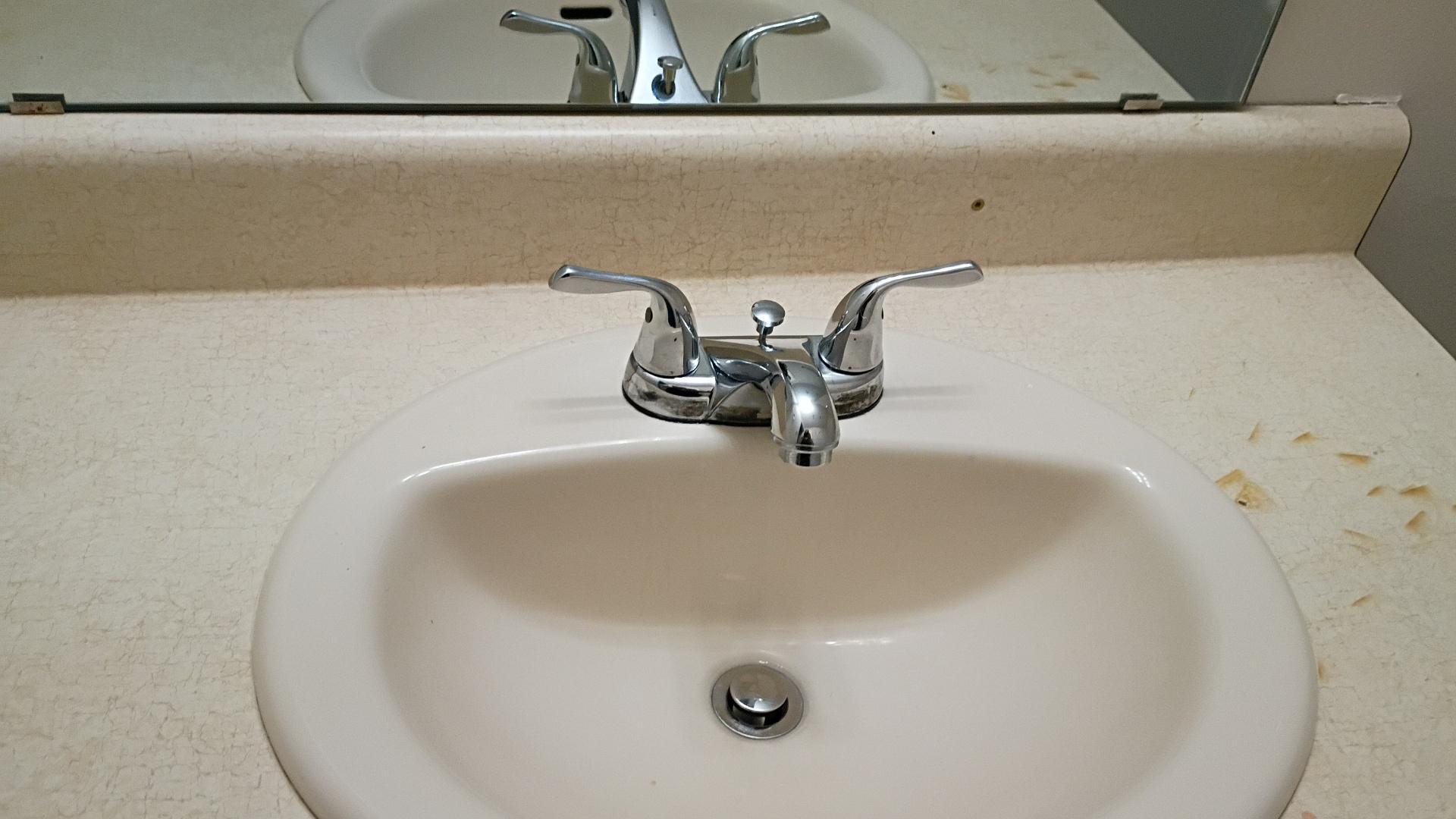 Bathroom sink after cleaning by Nelly Cleaning Service
